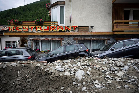 Cars stuck in the rubble after landslide